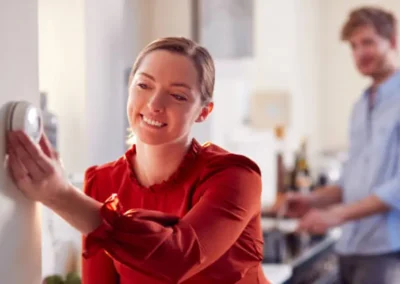Woman looking at monitor on wall